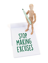 Image showing Wooden mannequin writing - Stop making excuses