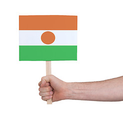 Image showing Hand holding small card - Flag of Niger