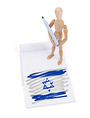 Image showing Wooden mannequin made a drawing - Israel