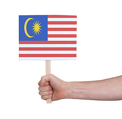 Image showing Hand holding small card - Flag of Malaysia