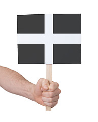 Image showing Hand holding small card - Flag of Cornwall