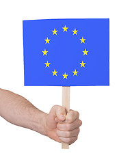 Image showing Hand holding small card - Flag of the European Union