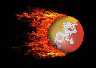 Image showing Flag with a trail of fire - Bhutan