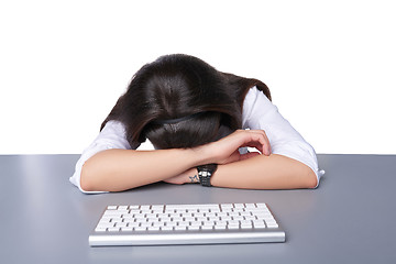 Image showing Businesswoman asleep on her laptop