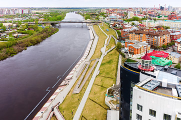 Image showing Pedestrian quay and bridge over Tura river. Tyumen