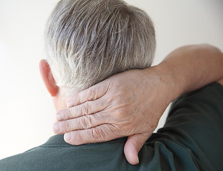 Image showing senior man with hand on neck   