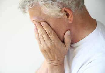 Image showing older man overcome with depression or emotions 