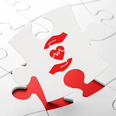 Image showing Insurance concept: Heart And Palm on puzzle background