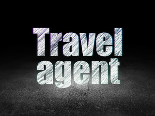 Image showing Vacation concept: Travel Agent in grunge dark room