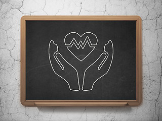 Image showing Insurance concept: Heart And Palm on chalkboard background