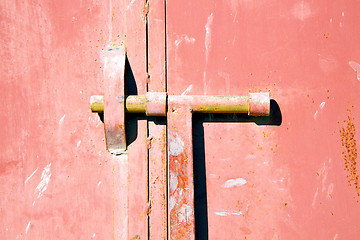 Image showing red  in africa the old wood  facade home and safe padlock 