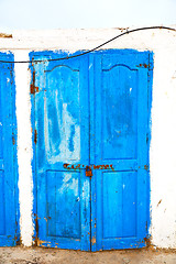 Image showing in africa   old harbor wood   door and the blue sky