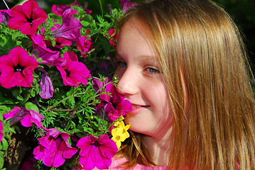 Image showing Young girl with flowers