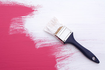 Image showing Covering pink paint with a coat of white emulsion