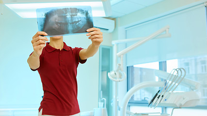 Image showing doctor or dentist looking at x-ray