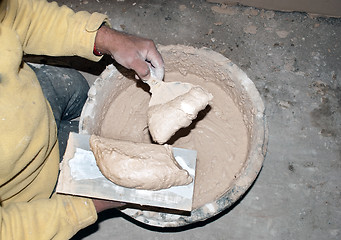 Image showing plasterer gaining mixture