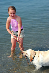 Image showing Girl play dog