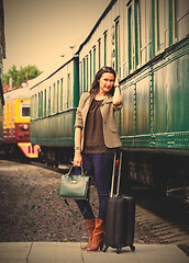 Image showing beautiful middle-aged woman with luggage