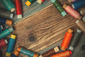 Image showing Vintage spools with multi colored threads