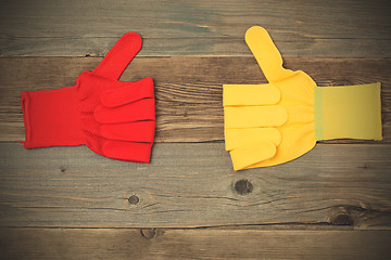 Image showing two gloves with raised thumb up