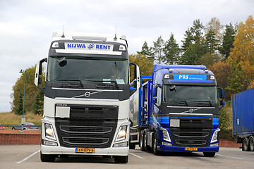 Image showing Two Volvo FH Tank Trucks Leaving Truck Stop