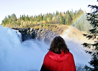 Image showing Woman by a foaming waterfall