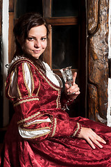 Image showing Pretty woman in red dress in retro baroque style