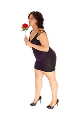 Image showing Lovely woman with red rose.