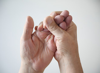 Image showing man squeezing his hand