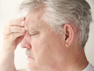 Image showing man with headache over eye