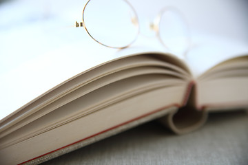 Image showing glasses on top of book