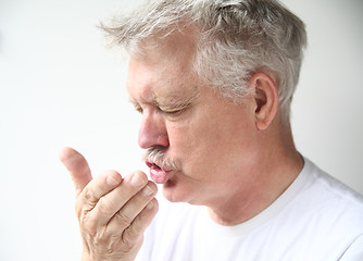 Image showing Man sneezes 