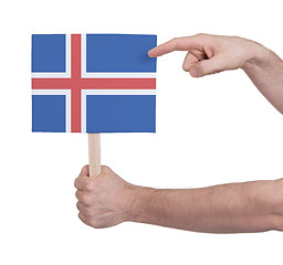 Image showing Hand holding small card - Flag of Iceland