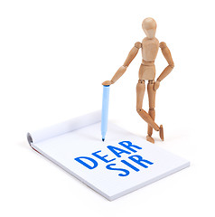 Image showing Wooden mannequin writing - Dear sir