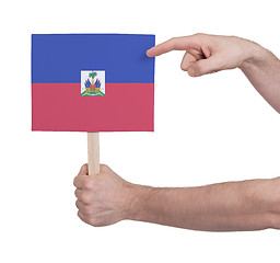 Image showing Hand holding small card - Flag of Haiti