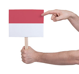 Image showing Hand holding small card - Flag of Indonesia