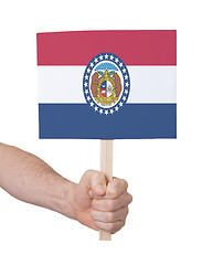 Image showing Hand holding small card - Flag of Missouri