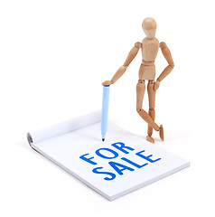 Image showing Wooden mannequin writing - For sale