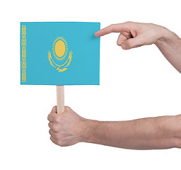 Image showing Hand holding small card - Flag of Kazakhstan