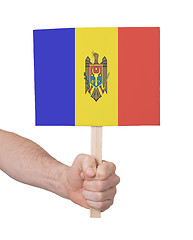 Image showing Hand holding small card - Flag of Moldova
