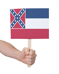 Image showing Hand holding small card - Flag of Mississippi
