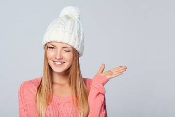 Image showing Winter woman winking at you