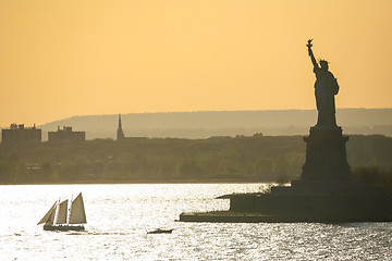 Image showing Sailboat next to Liberty Statue