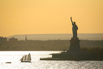 Image showing Sailboat next to Statue of Liberty