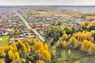 Image showing Aerial view onto rural street in autumn. Russia