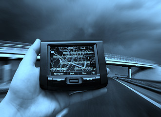 Image showing GPS Vehicle navigation system in a man hand.