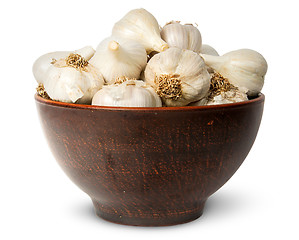 Image showing In front whole head of garlic in ceramic bowl