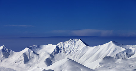 Image showing Panoramic view on off-piste snowy slope at nice sunny day