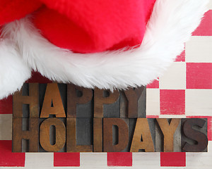 Image showing Santa Claus hat with happy holidays words