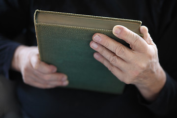 Image showing hands holding a book 